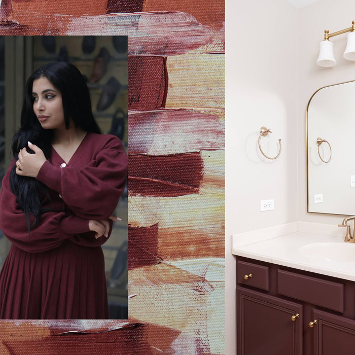 Burgundy color trend collage with fashion and interior design inspiration, showing a woman in a burgundy dress layered over textured burgundy artwork next to a modern bathroom vanity with burgundy cabinets, gold fixtures, and contemporary décor.