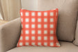 Decorative pillow upholstered in Revolution Performance Fabric Denmark Mango, featuring a warm orange plaid pattern with layered vertical and horizontal bands that create a classic, tailored aesthetic. The performance construction makes it ideal for everyday family-friendly living.
