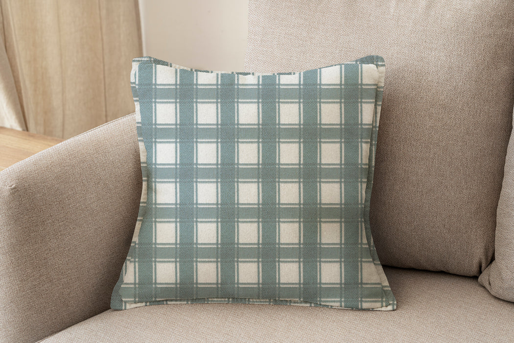 Decorative pillow upholstered in Revolution Performance Fabric Denmark Powder, featuring a cool blue-grey plaid pattern with layered vertical and horizontal bands that create a classic, tailored aesthetic. The performance construction makes it ideal for everyday family-friendly living.