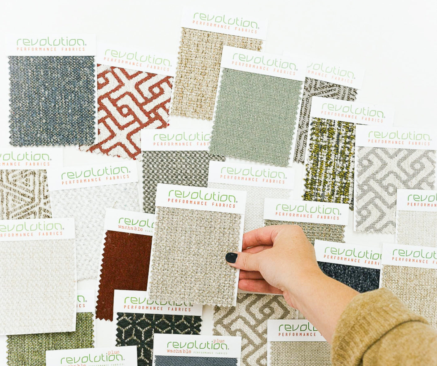 Designer reviewing Revolution fabric swatches