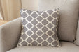 Revolution Performance Fabric accent pillow in the Metalwork pattern, Conch colorway, showcasing a soft warm grey and ivory geometric trellis design woven for high-performance upholstery and refined interior styling.