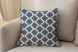 Revolution Performance Fabric accent pillow in the Metalwork pattern, Marine colorway, showcasing a rich navy blue and ivory geometric trellis design woven for high-performance upholstery and refined interior styling.