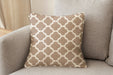Revolution Performance Fabric accent pillow in the Metalwork pattern, Sand colorway, showcasing a warm beige and ivory geometric trellis design woven for high-performance upholstery and refined interior styling.