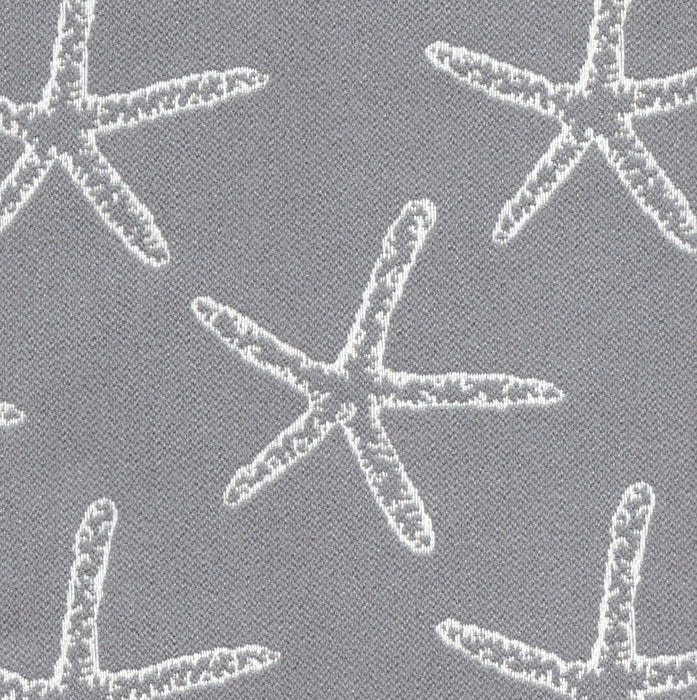 Revolution Performance Fabric, pattern Seastar in the color Conch, featuring crisp white starfish motifs woven over a deep teal-green background for a coastal-inspired upholstery look with durable performance appeal.