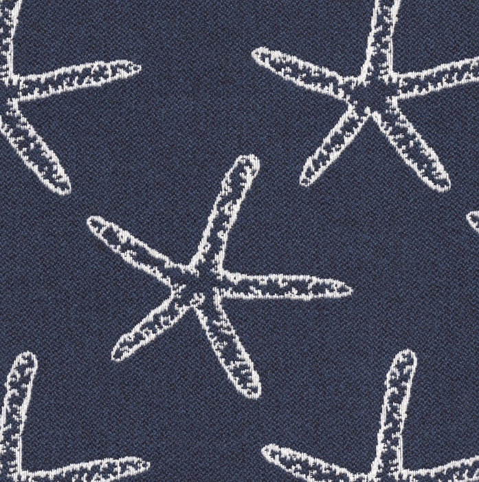 Revolution Performance Fabric, pattern Seastar in the color Indigo, featuring crisp white starfish motifs woven over a deep teal-green background for a coastal-inspired upholstery look with durable performance appeal.