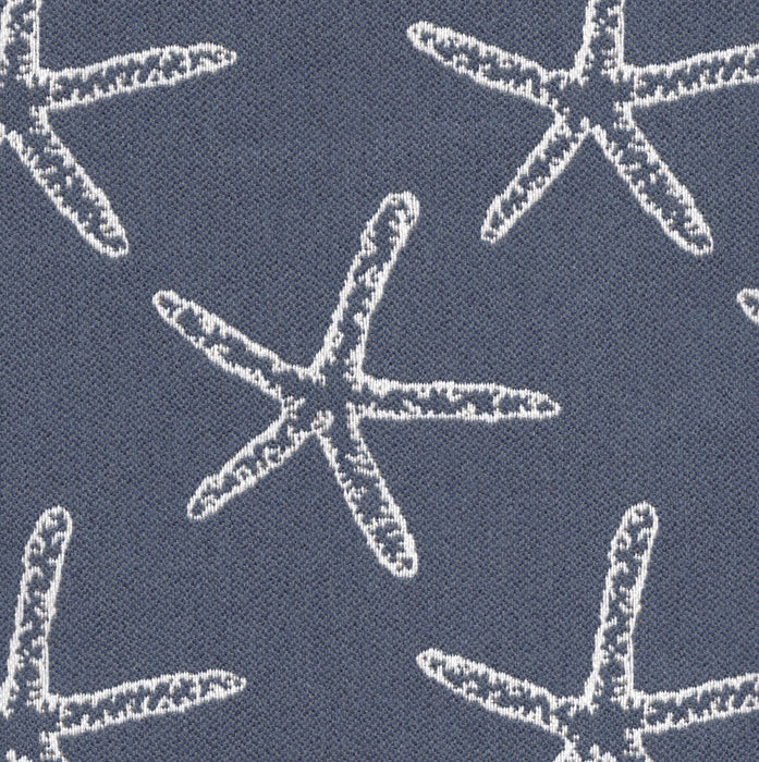 Revolution Performance Fabric, pattern Seastar in the color Marine, featuring crisp white starfish motifs woven over a deep teal-green background for a coastal-inspired upholstery look with durable performance appeal.