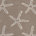 Revolution Performance Fabric, pattern Seastar in the color Sand, featuring crisp white starfish motifs woven over a deep teal-green background for a coastal-inspired upholstery look with durable performance appeal.