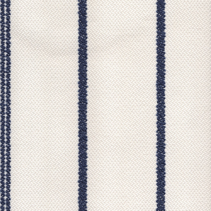 Revolution Performance Fabric, pattern Starboard in the color Navy, featuring bold navy blue vertical stripes against an ivory background for a timeless nautical stripe upholstery fabric with durable performance properties.