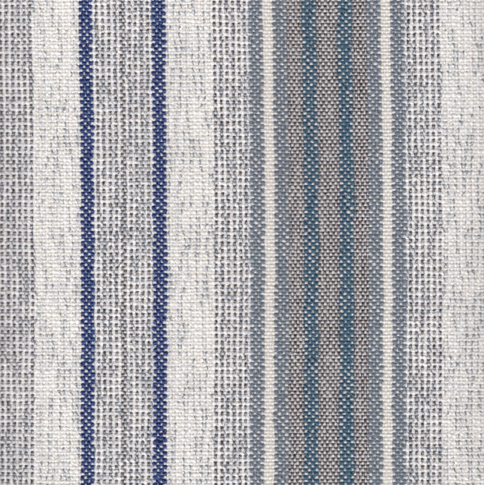 Flat view of Revolution Performance Upholstery Fabric, pattern Jansen in Denim, featuring crisp vertical stripes formed by slightly raised woven bands in layered blue, slate, and neutral tones. The alternating stripe widths and subtly textured yarns create gentle dimension and a timeless, tailored rhythm across the fabric surface.